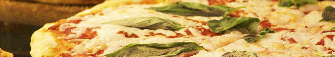 Eating Pizza at Little Italy Pizzeria restaurant in Saranac Lake, NY.